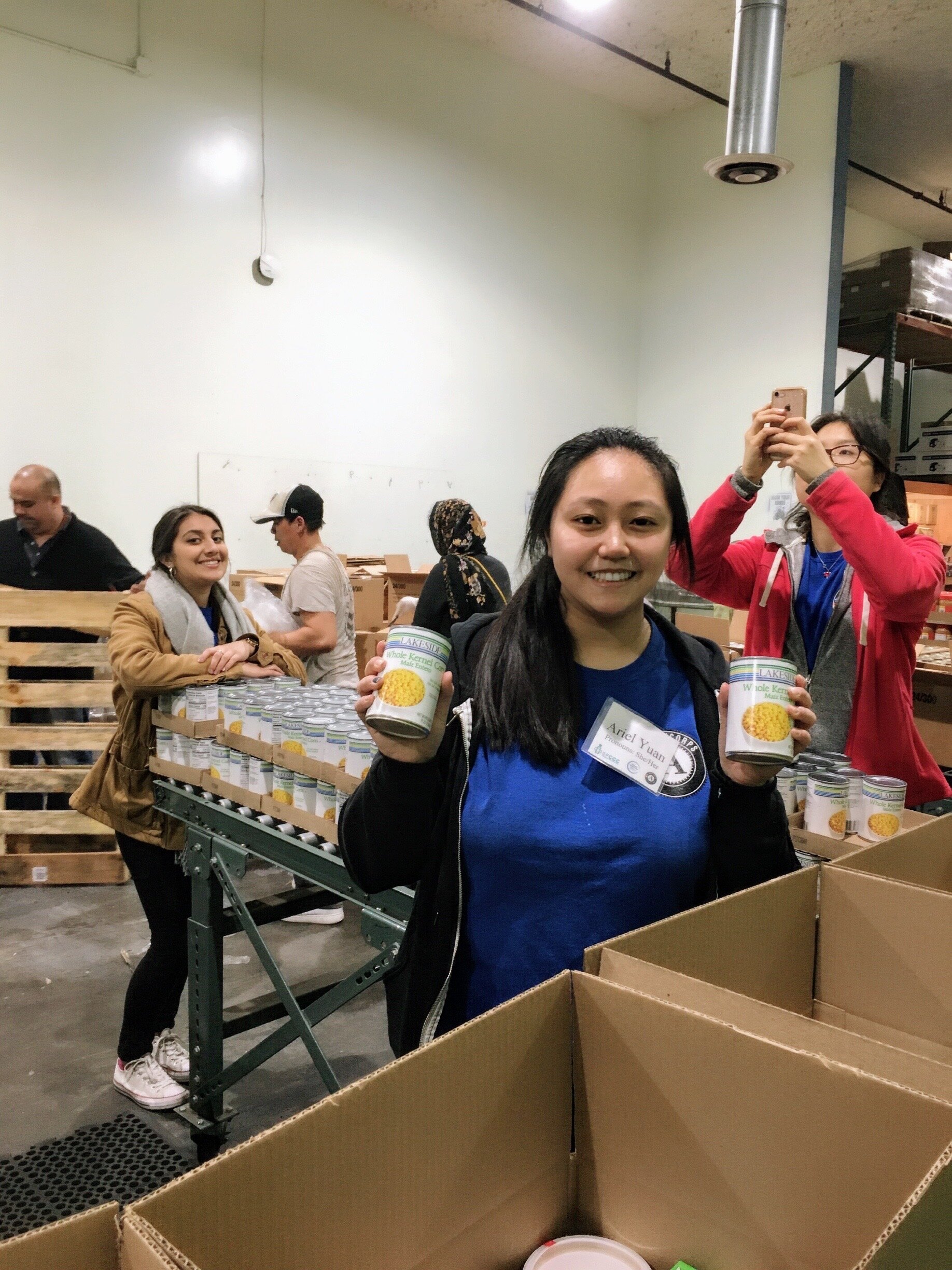 NHC SF members, Ariel, Neha, and Joanne, serving at SF-Marin Food Bank.