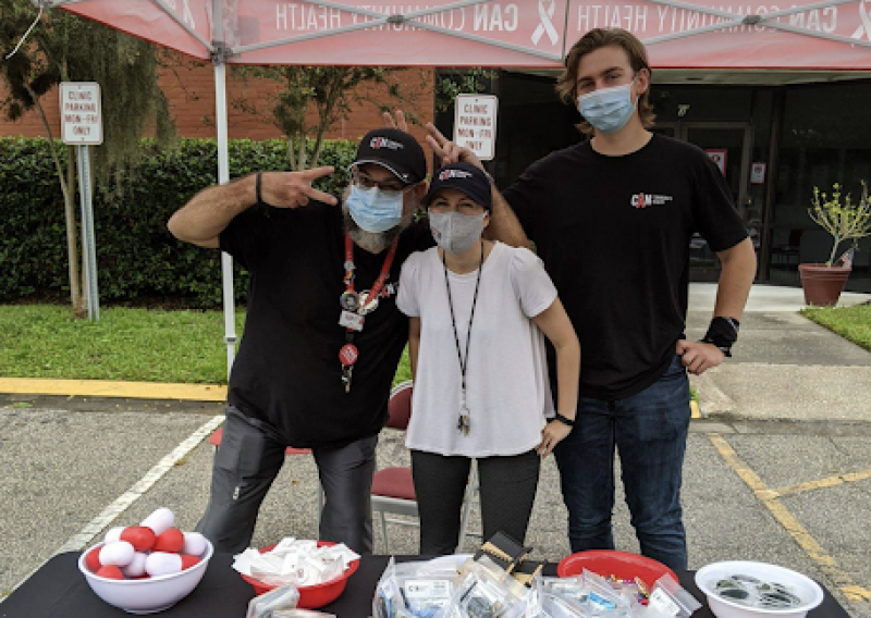 tabling outside of the CAN clinic to hand out condoms and chatting about how to protect your sexual health.