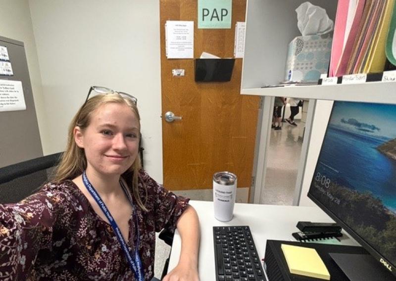 Maddie sitting at desk