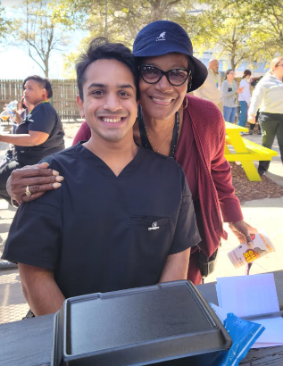 Rehan is pictured with a member of the Sulzbacher Community.