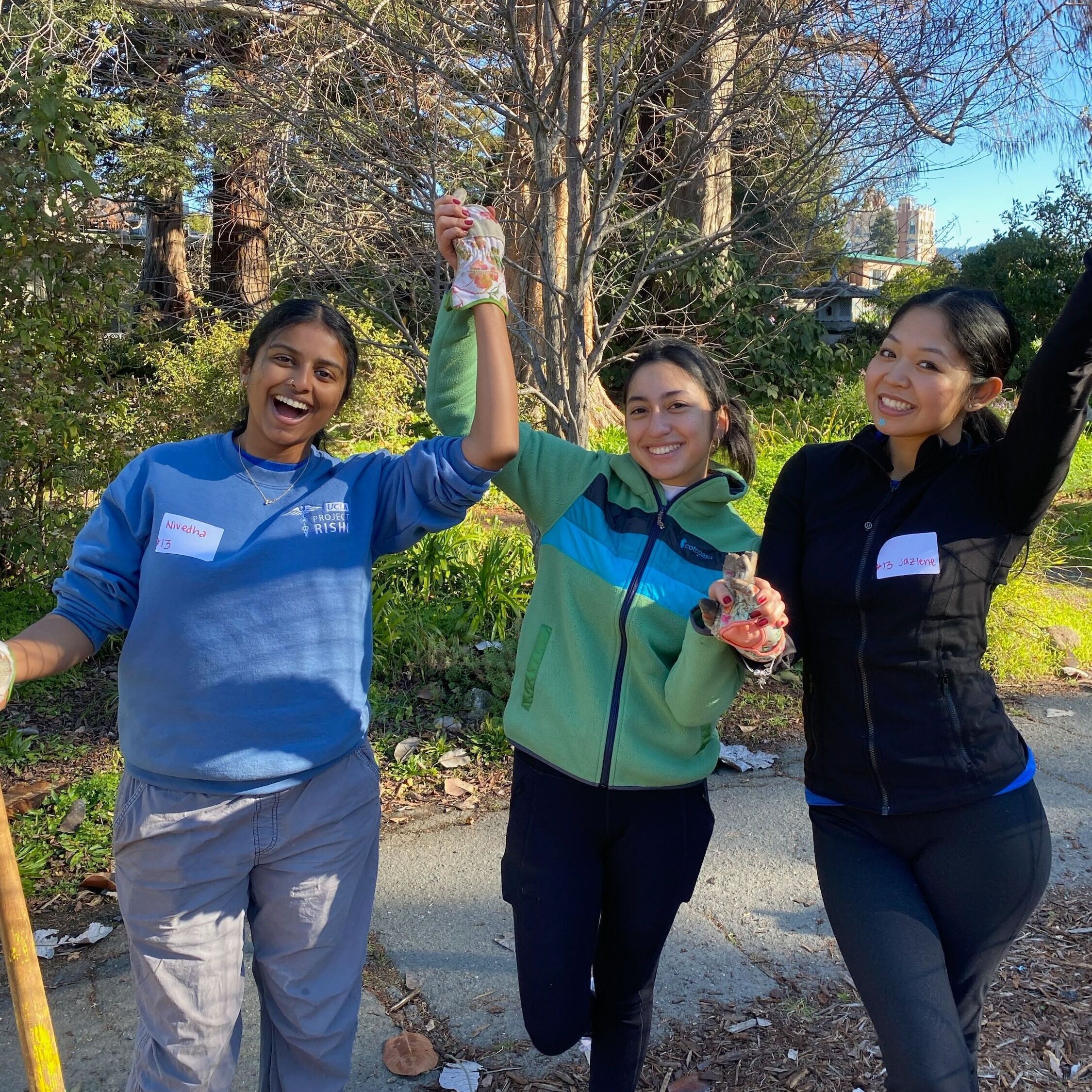 From left to right, Nivedha, Laura, and Jazlene pose for a photo during a weekend volunteering event.